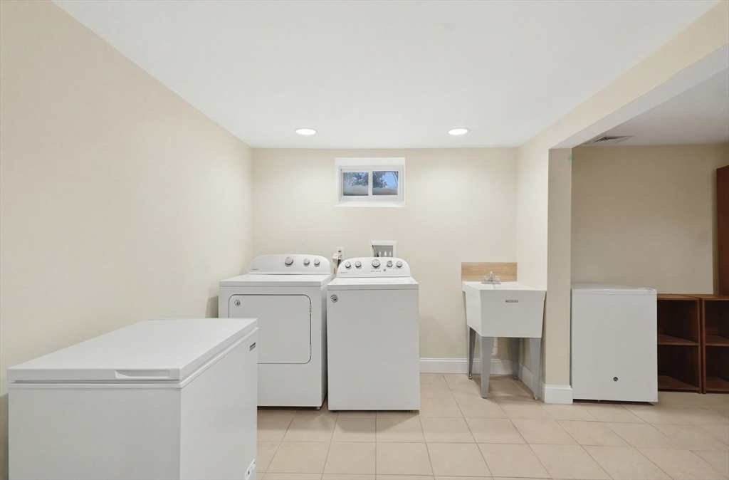 24 Holly Street Billerica, MA 01821 - Photo 28 of 33 a utility room with dryer and washer