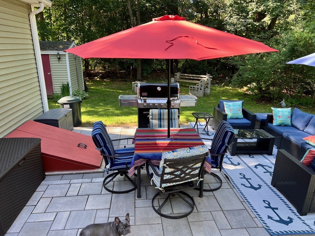24 Holly Street Billerica, MA 01821 - Photo 29 of 33 a view of an outdoor sitting area with furniture and umbrella