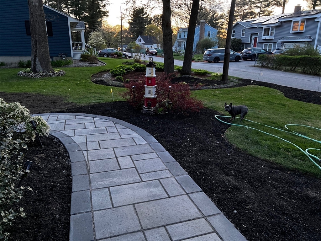 24 Holly Street Billerica, MA 01821 - Photo 31 of 33 a view of backyard with garden and seating