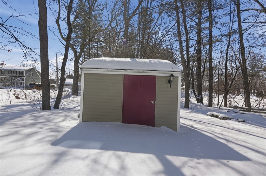 24 Holly Street Billerica, MA 01821 - Photo 33 of 33 a view of a house with a yard and garage