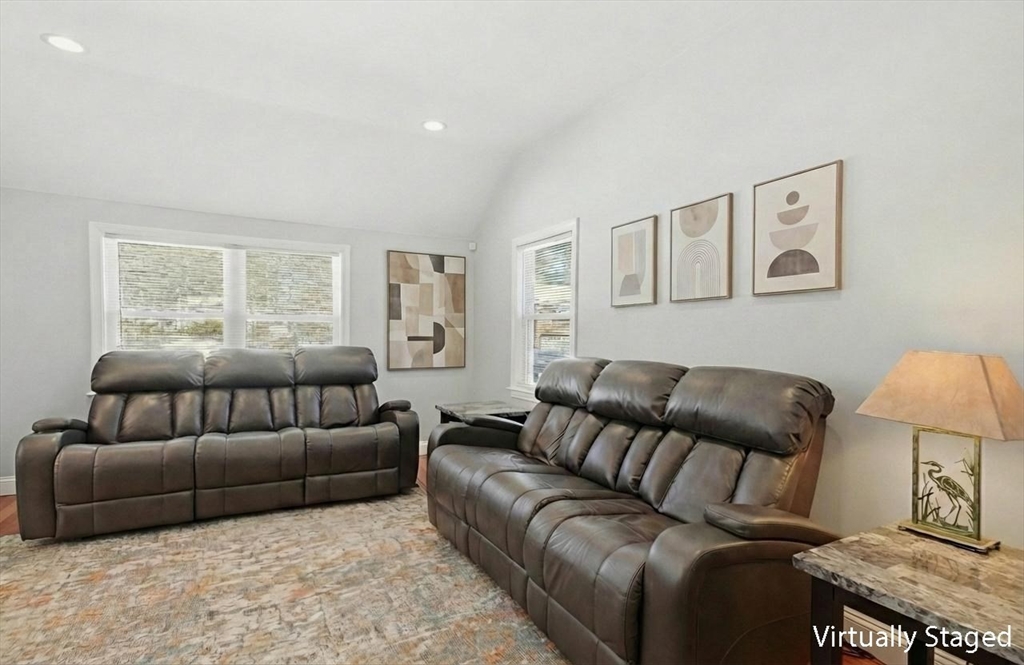 24 Holly Street Billerica, MA 01821 - Photo 4 of 33 a living room with furniture a couch and a lamp on dresser next to a window