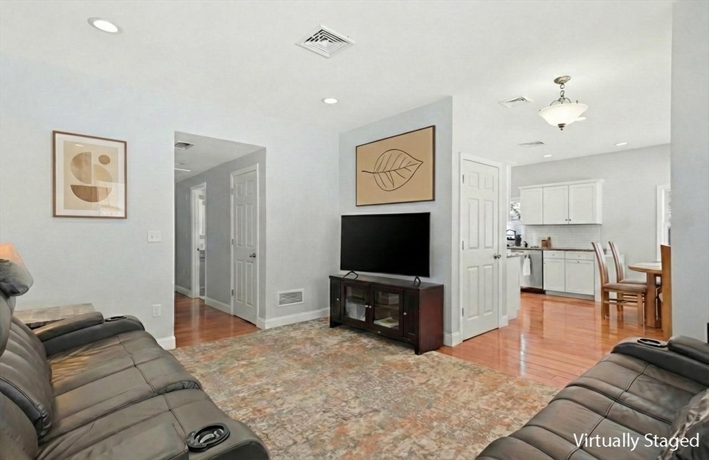 24 Holly Street Billerica, MA 01821 - Photo 5 of 33 a living room with furniture and a flat screen tv