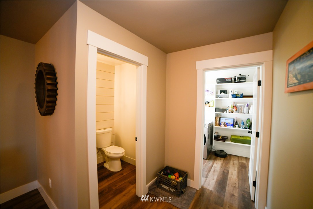 202 St Helens Way Winlock, WA 98596 - Photo 11 of 25 a view of a hallway with room and wooden floor