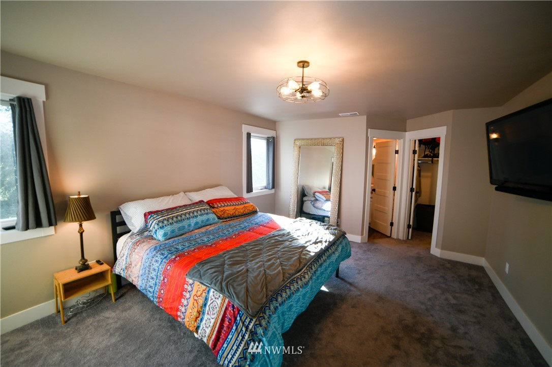 202 St Helens Way Winlock, WA 98596 - Photo 15 of 25 a bedroom with a bed and a flat screen tv