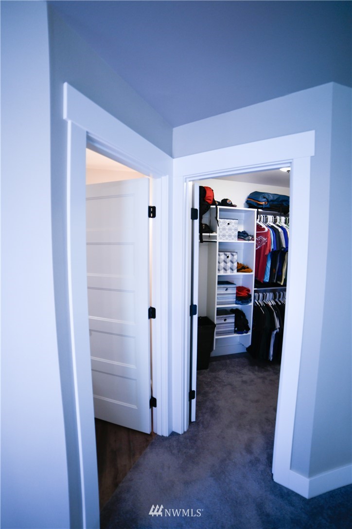 202 St Helens Way Winlock, WA 98596 - Photo 18 of 25 a view of walk in closet with clothes and shoes