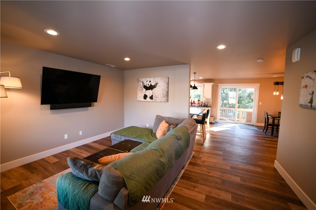 202 St Helens Way Winlock, WA 98596 - Photo 2 of 25 a living room with furniture and a flat screen tv