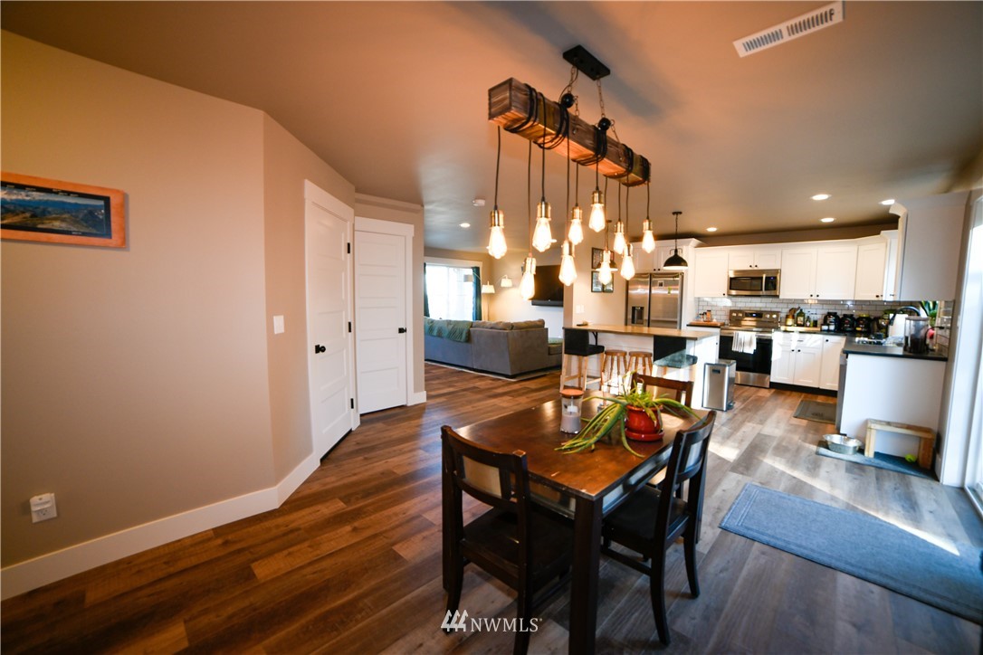 202 St Helens Way Winlock, WA 98596 - Photo 7 of 25 a dining room with furniture and wooden floor
