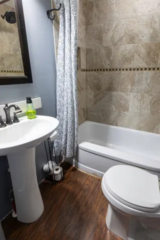 a bathroom with a sink toilet and bathtub