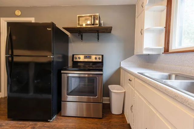 a kitchen with a stove and a refrigerator