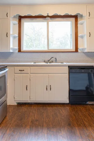 a view with a sink a window and a fireplace