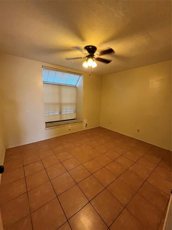 4460 Chaha Road, Unit 205 Garland, TX 75043 - Photo 15 of 27 a view of an empty room and window