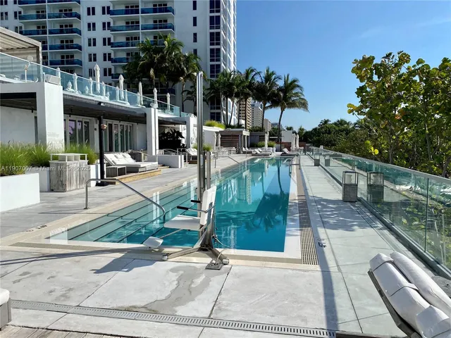 a view of a swimming pool with a patio