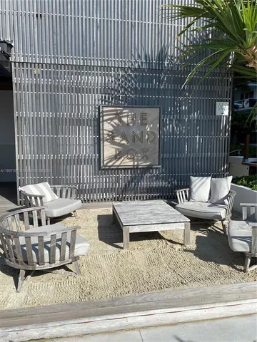 a view of a balcony with two chairs and a table