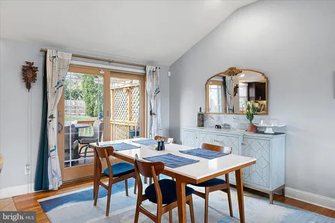 a view of a dining room with furniture and window