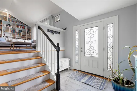 a view of entryway with a window and stairs
