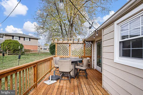 a view of a two chairs and table in the balcony