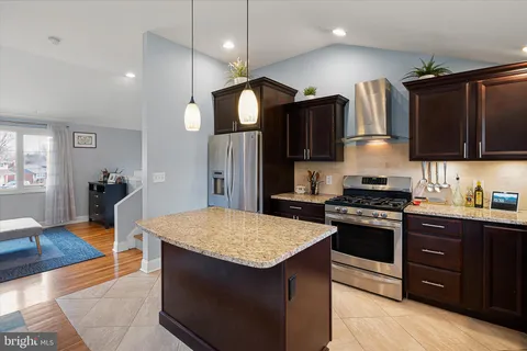 a kitchen with a sink stove and refrigerator
