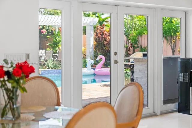 a view of living room with furniture and a potted plant