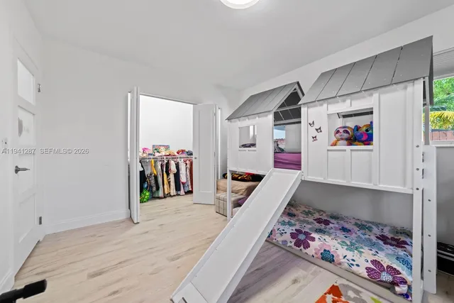 a view of a hallway with workspace and closet