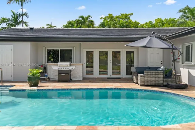a front view of a house with a yard table and chairs