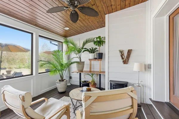 a room with furniture and a large window