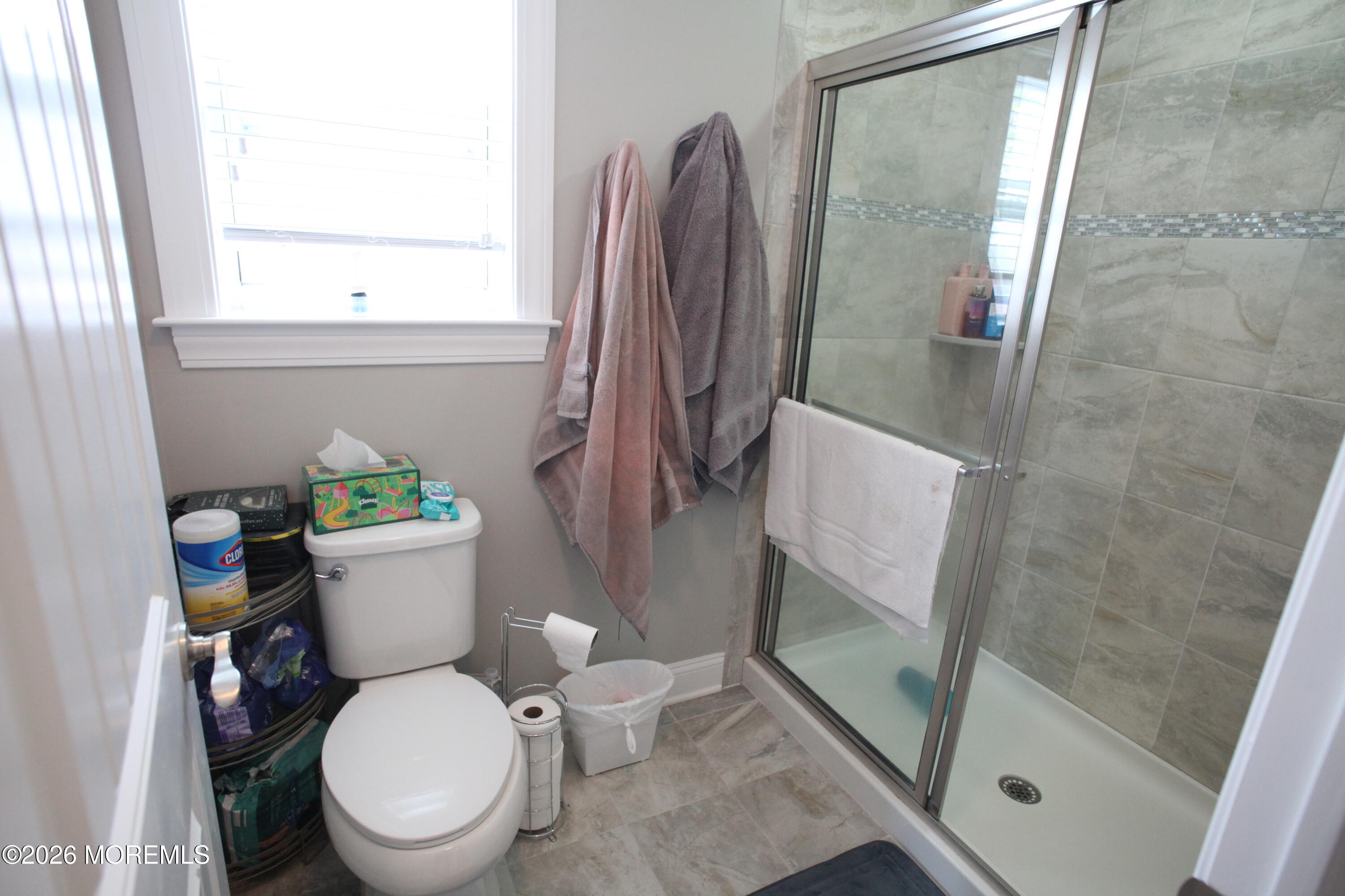 107 Waldron Road Toms River, NJ 08753 - Photo 12 of 20 a white toilet sitting next to a bathroom sink