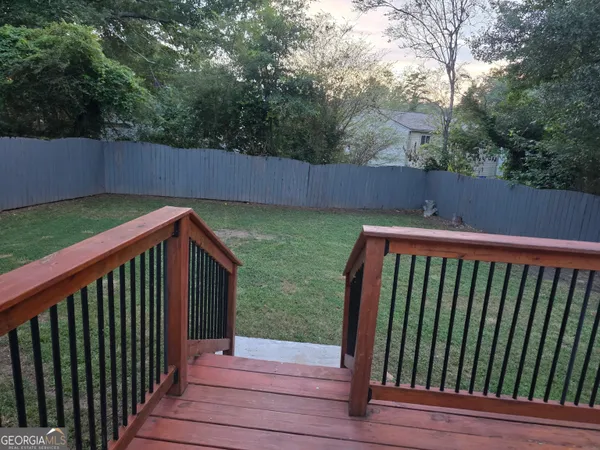 a view of deck and backyard