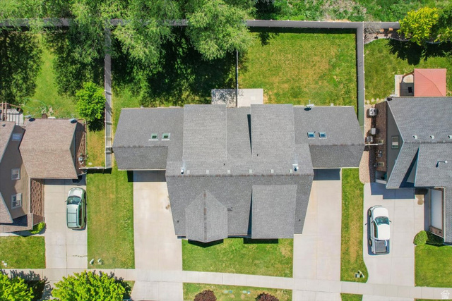 857 225 South Springville, UT 84663 - Photo 22 of 23 Overhead perspective showcasing a residential property with a dark shingled roof and multiple skylights