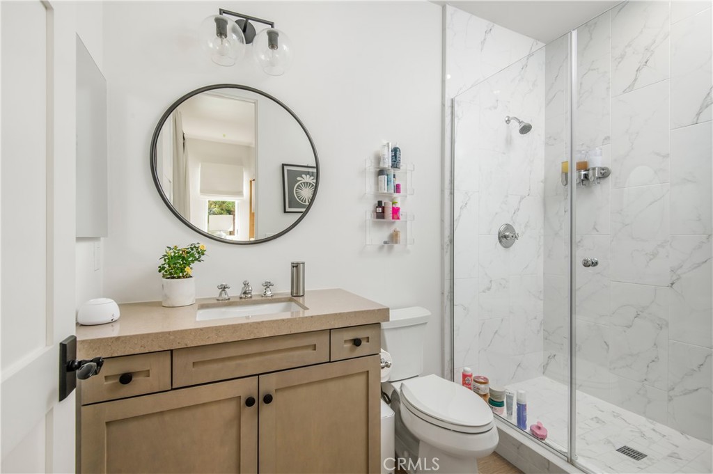 28750 Martingale Drive San Juan Capistrano, CA 92675 - Photo 16 of 45 a bathroom with a sink a toilet and a mirror