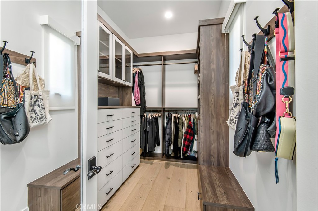 28750 Martingale Drive San Juan Capistrano, CA 92675 - Photo 23 of 45 a view of walk in closet with clothes and shoes