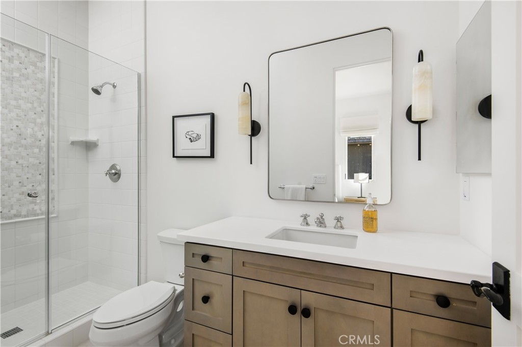 28750 Martingale Drive San Juan Capistrano, CA 92675 - Photo 25 of 45 a bathroom with a sink a toilet and shower