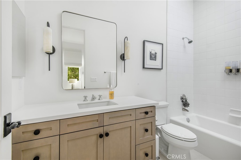 28750 Martingale Drive San Juan Capistrano, CA 92675 - Photo 27 of 45 a bathroom with a sink a toilet and a mirror