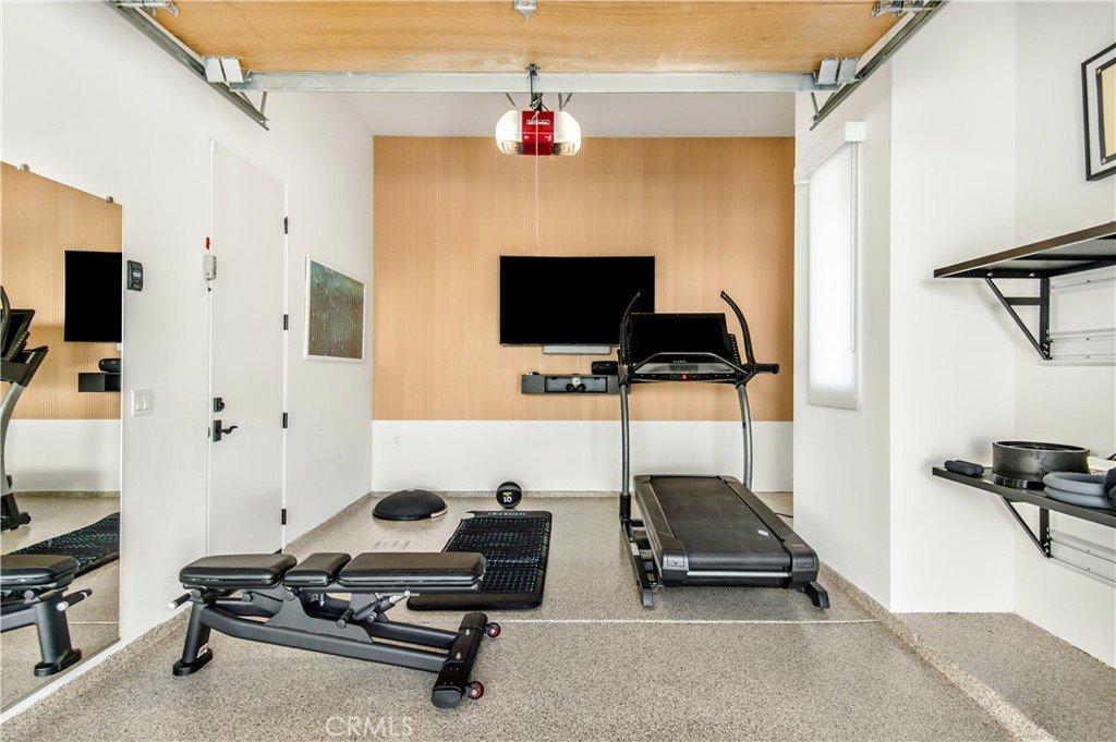 28750 Martingale Drive San Juan Capistrano, CA 92675 - Photo 31 of 45 a room with gym equipment and a flat screen tv