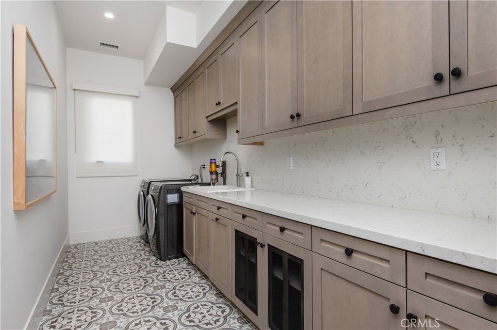 28750 Martingale Drive San Juan Capistrano, CA 92675 - Photo 32 of 45 a kitchen with a sink and cabinets