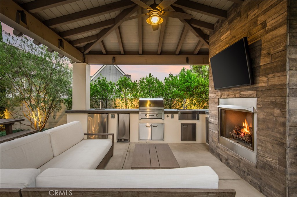 28750 Martingale Drive San Juan Capistrano, CA 92675 - Photo 4 of 45 a living room with furniture a flat screen tv and a fireplace