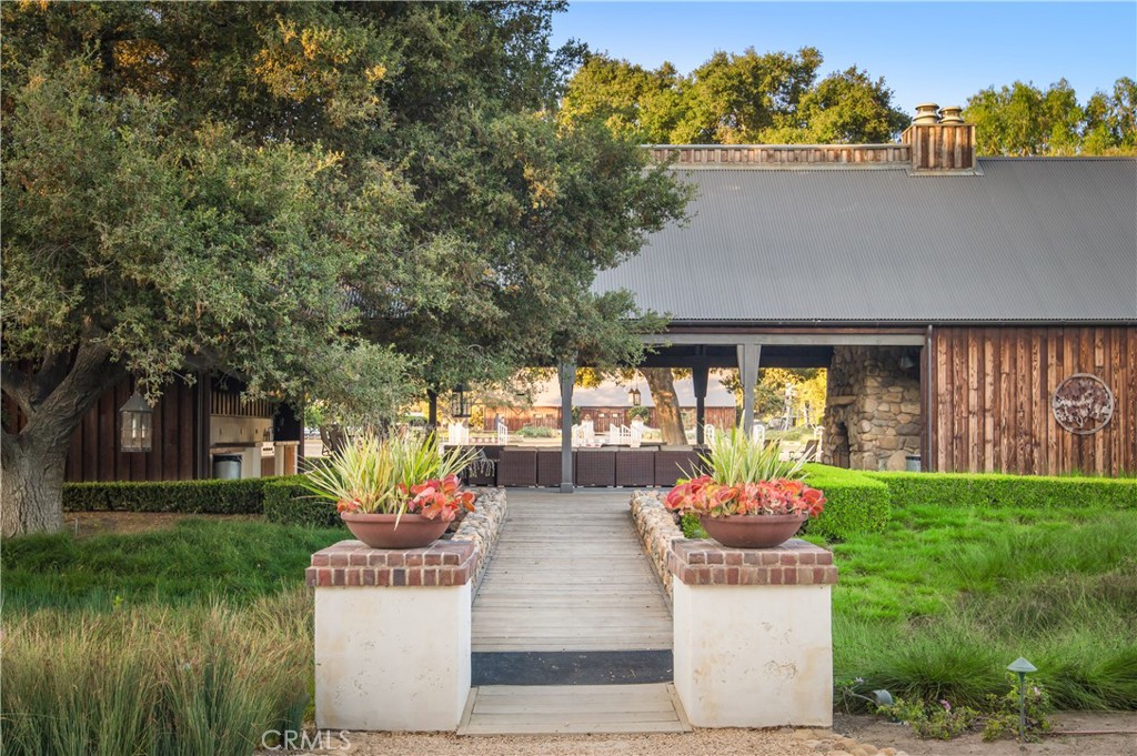 28750 Martingale Drive San Juan Capistrano, CA 92675 - Photo 41 of 45 a front view of a house with fountain and a garden