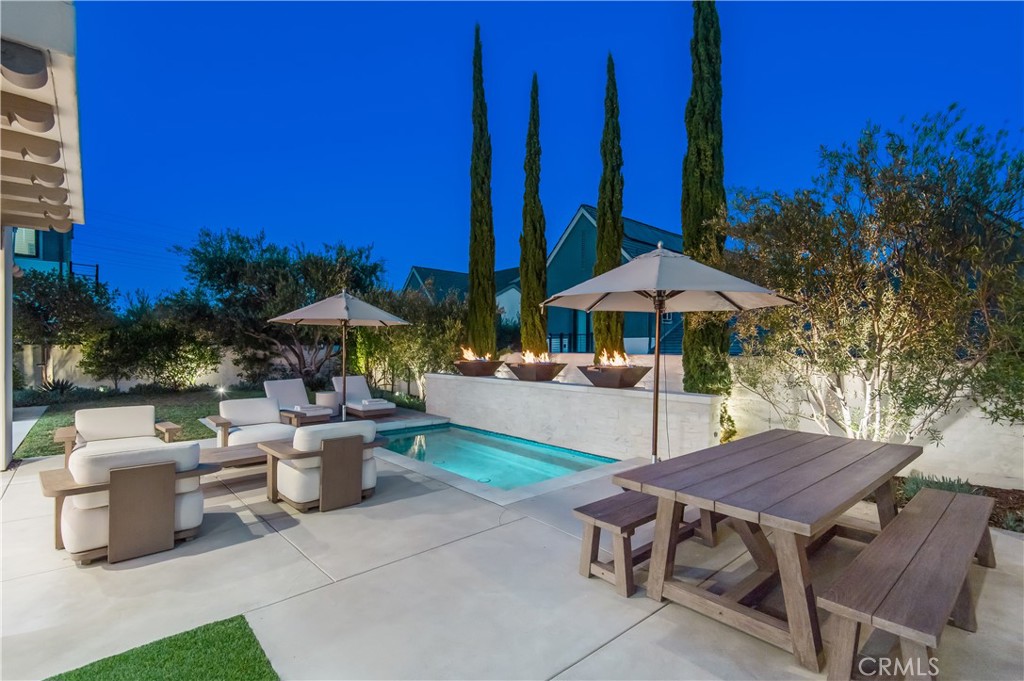 28750 Martingale Drive San Juan Capistrano, CA 92675 - Photo 6 of 45 a view of a patio with table and chairs under an umbrella