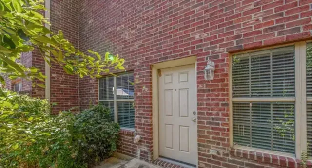 a brick building with a large window