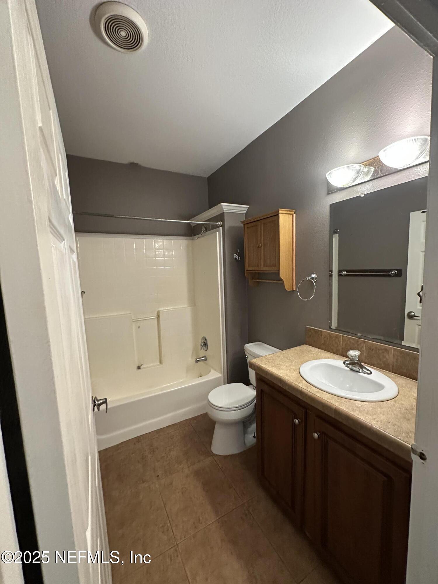 852030 Highway 17 Yulee, FL 32097 - Photo 18 of 21 a bathroom with a sink a toilet and shower