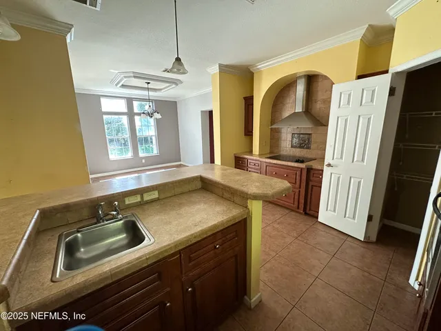 a kitchen with a sink stove and refrigerator