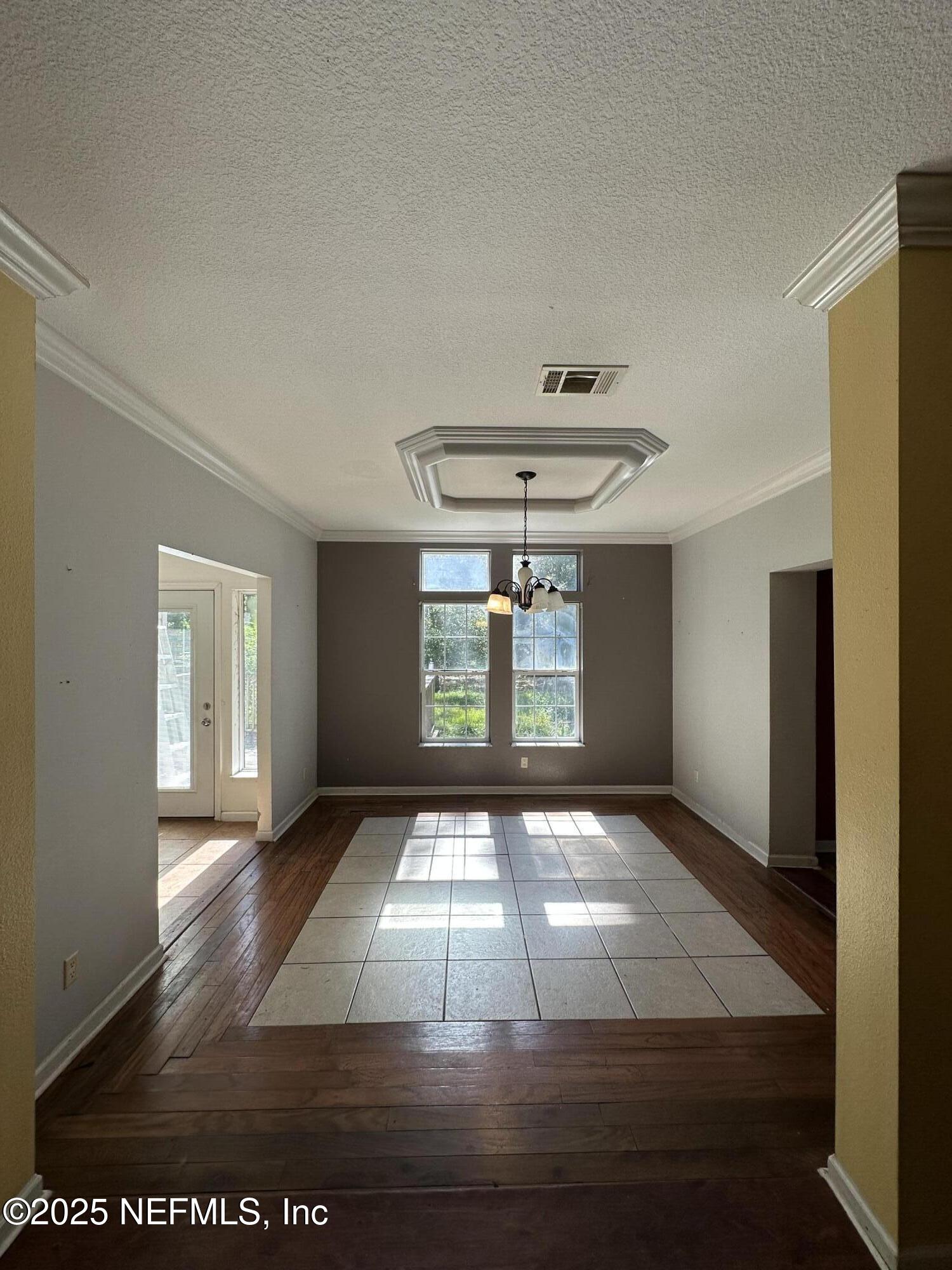 852030 Highway 17 Yulee, FL 32097 - Photo 5 of 21 a view of an empty room with window and wooden floor