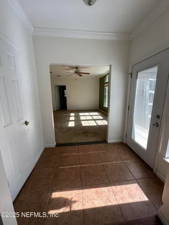 a view of an empty room with a window