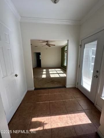 a view of an empty room with a window