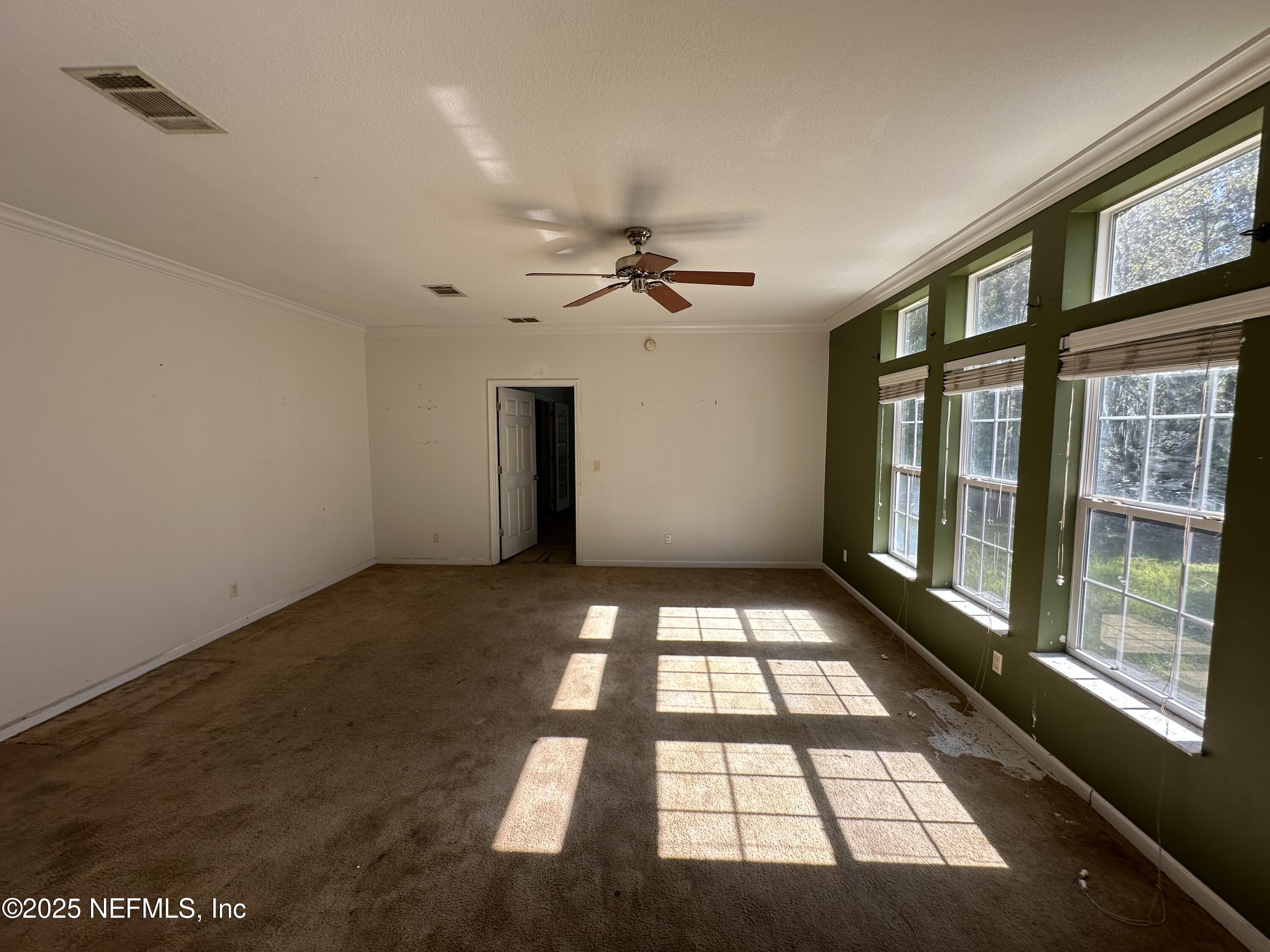 852030 Highway 17 Yulee, FL 32097 - Photo 7 of 21 a view of an empty room with a window