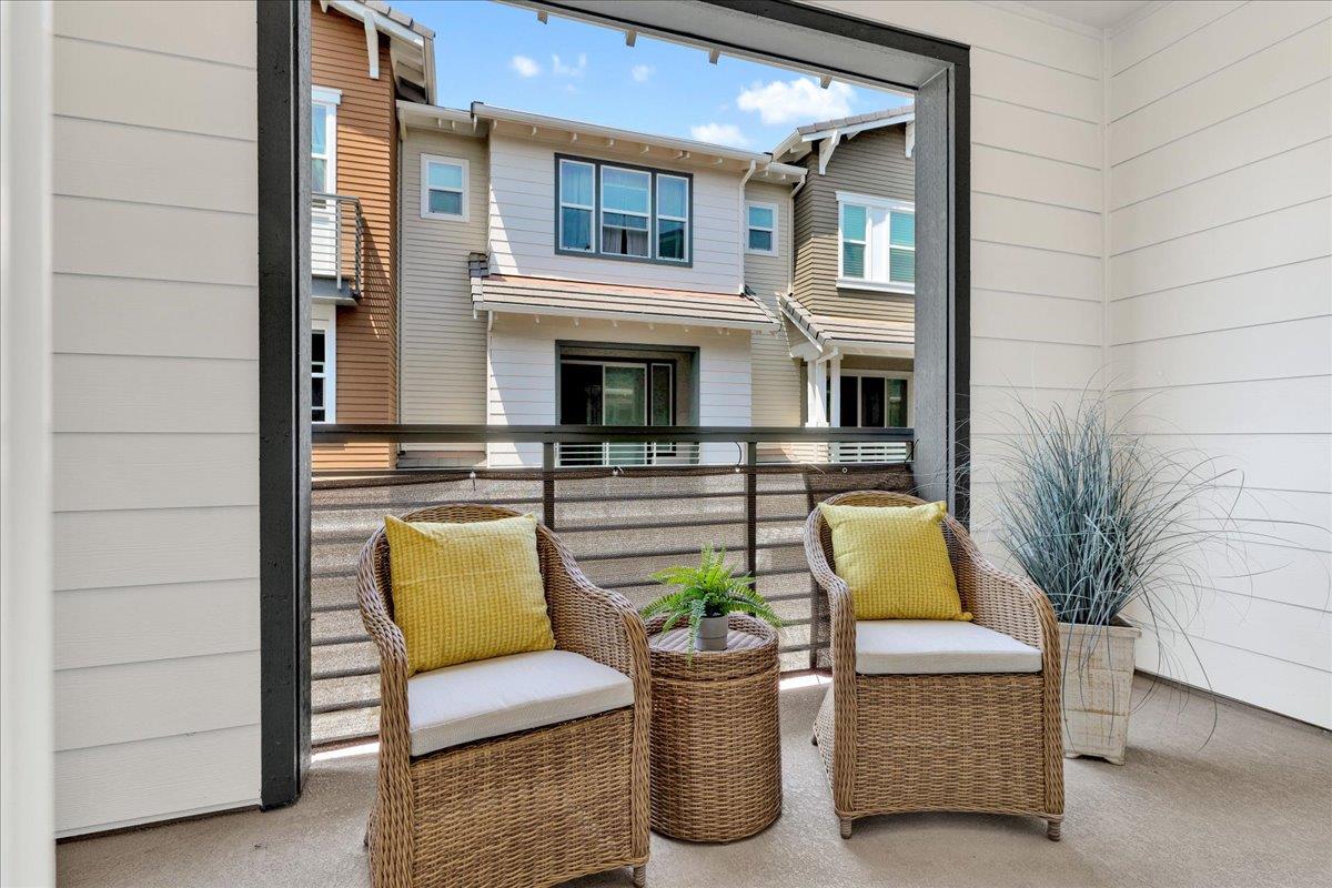 122 Ranch Lane Mountain View, CA 94040 - Photo 13 of 69 a view of a patio with couches chairs potted plants and wooden floor