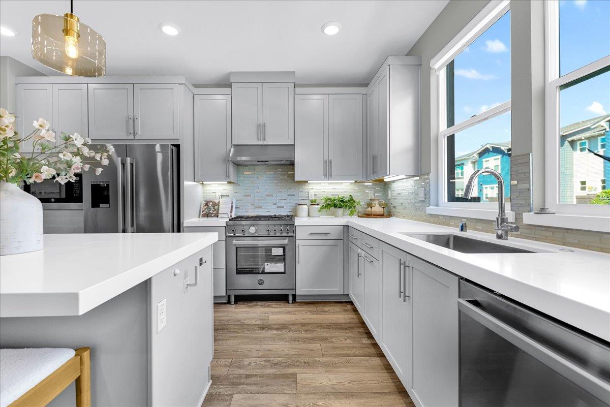 122 Ranch Lane Mountain View, CA 94040 - Photo 24 of 69 a kitchen with granite countertop a sink stainless steel appliances and cabinets