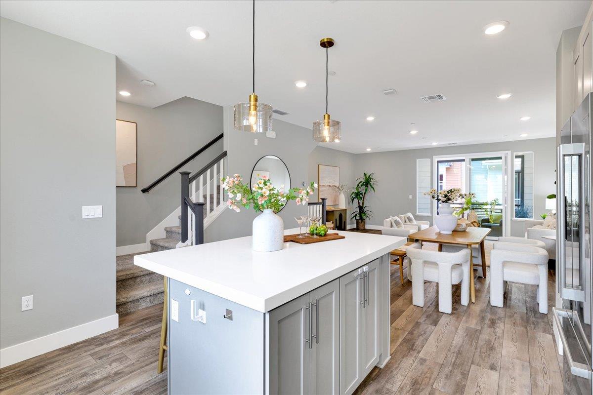 122 Ranch Lane Mountain View, CA 94040 - Photo 26 of 69 a open kitchen with a table chairs and wooden floor
