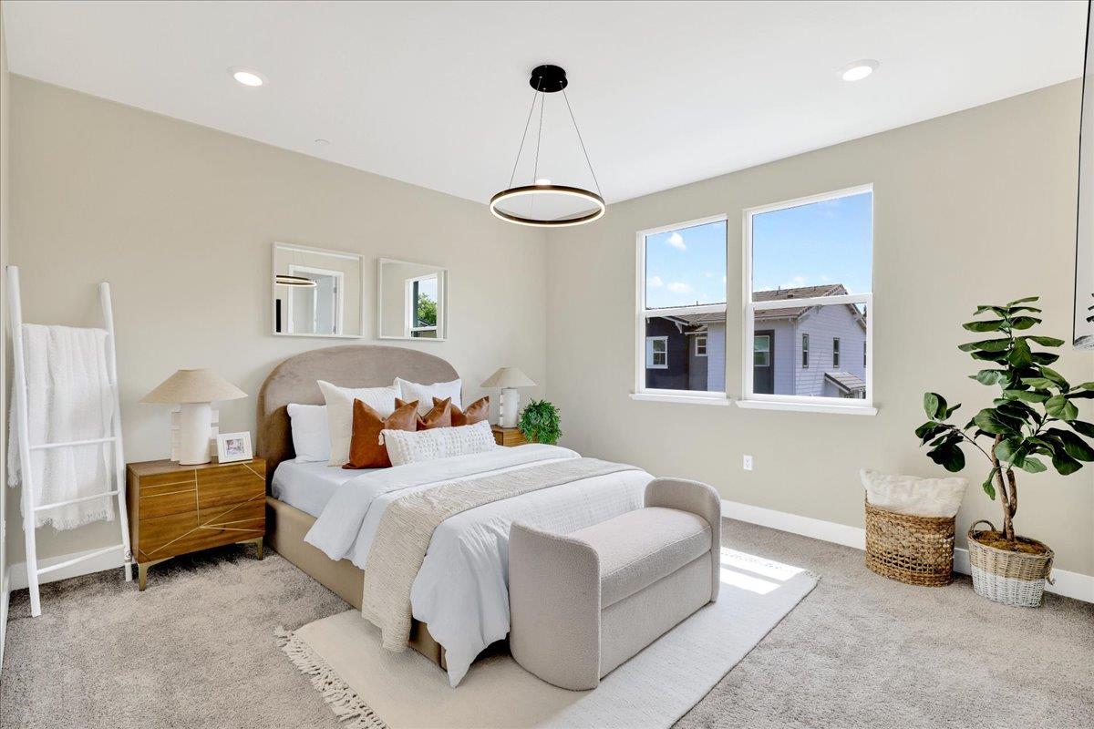 122 Ranch Lane Mountain View, CA 94040 - Photo 32 of 69 a bedroom with a large bed and a potted plant
