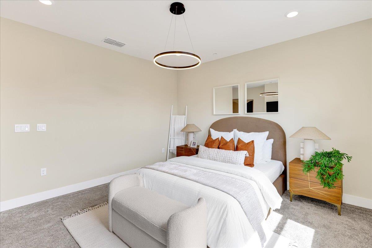 122 Ranch Lane Mountain View, CA 94040 - Photo 33 of 69 a bedroom with a bed and a chandelier