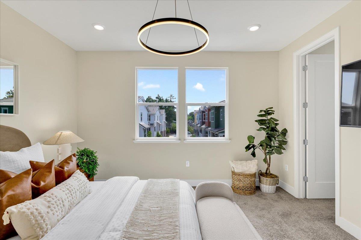 122 Ranch Lane Mountain View, CA 94040 - Photo 36 of 69 a bedroom with a bed and a chandelier